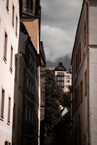 Brown and white concrete building during the day
